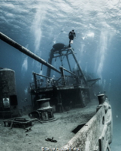 'On One Breath' - A freediver ascends from the wreck of t... by Tanya Houppermans 